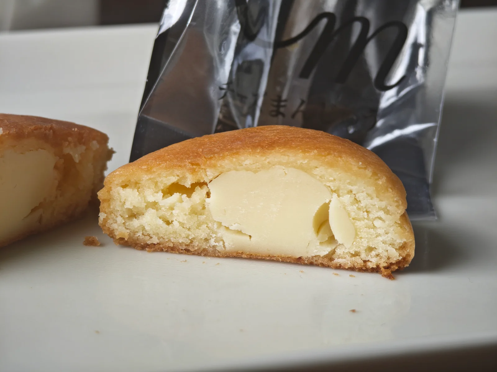 Cross-section of SEIKADO Cheese Manju showing a distinct cheese center