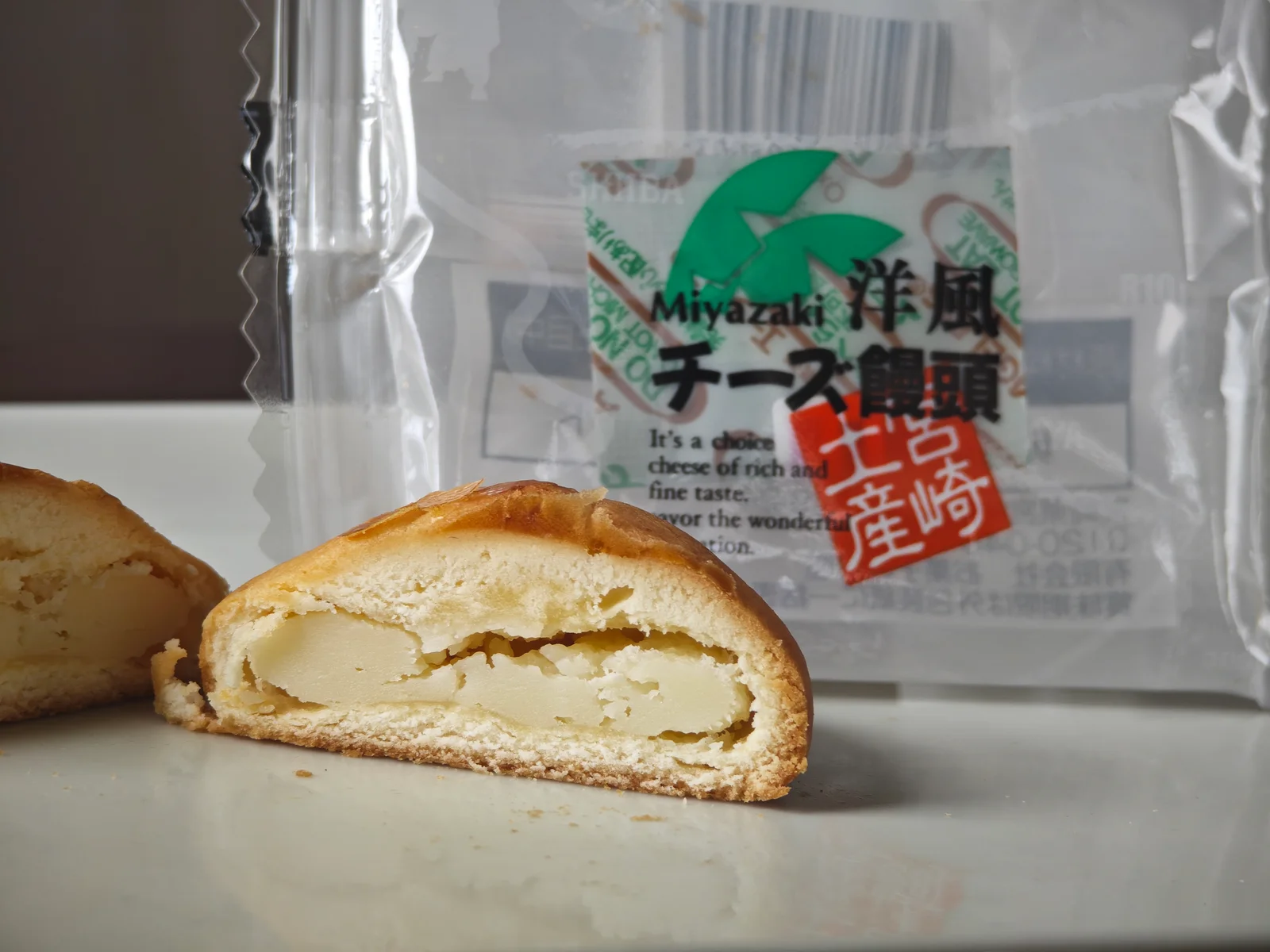 Cross-section of Hiroya Western Cheese Manju showing a generous cheese center