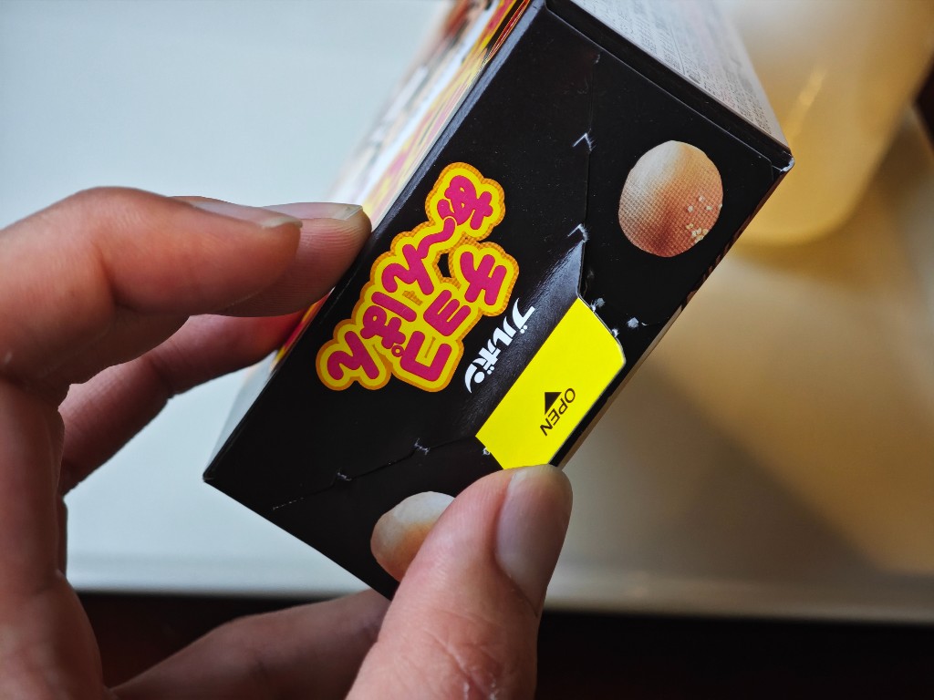 Yellow OPEN tab on the side of the Choco Anpan carton