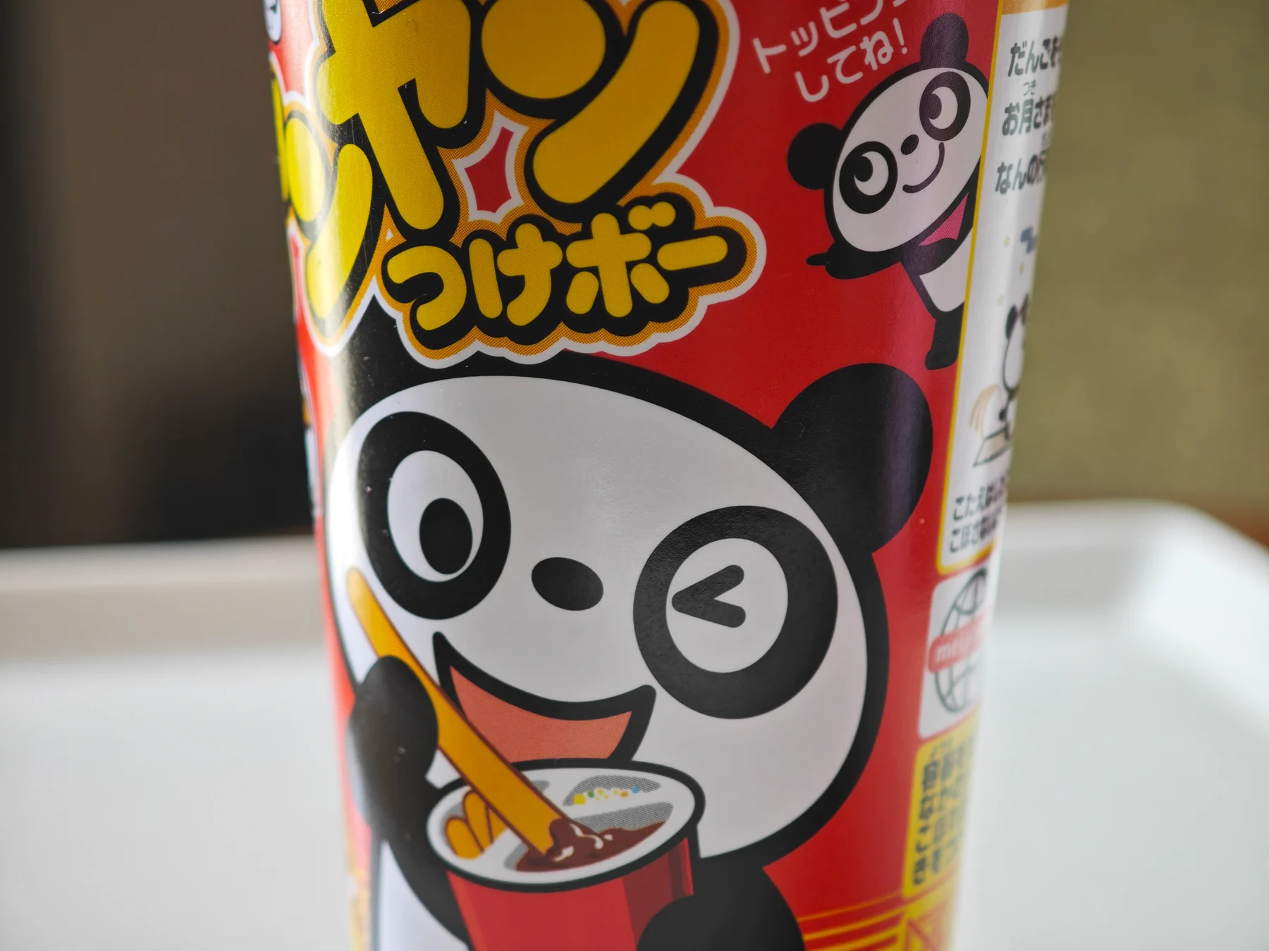 Close-up of the winking panda on a Yan Yan Tsuke-bo cup