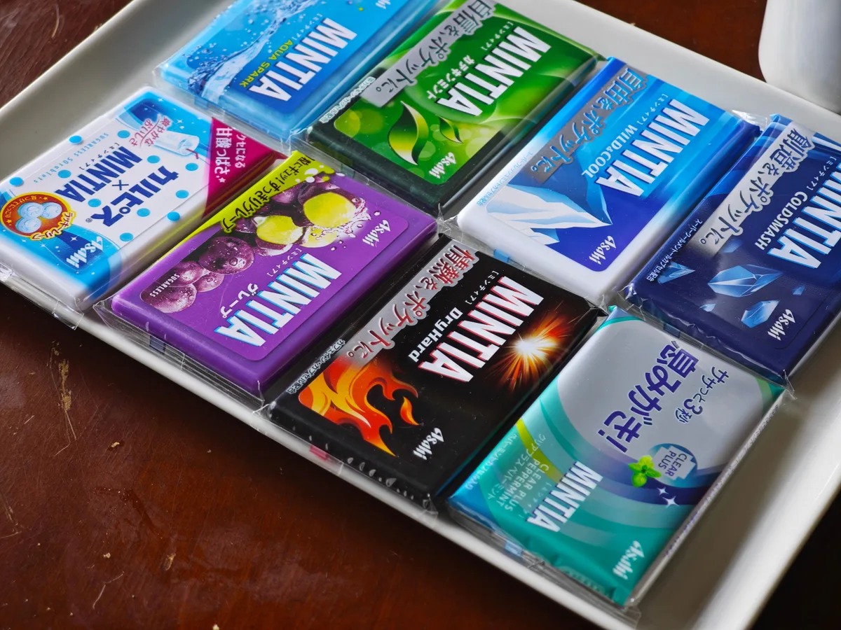 Eight MINTIA flavors arranged on a white tray