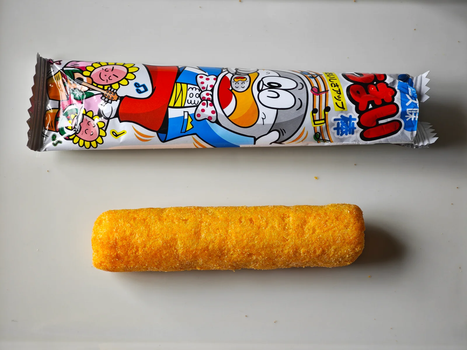 Cheese Umaibo wrapper and unwrapped corn stick