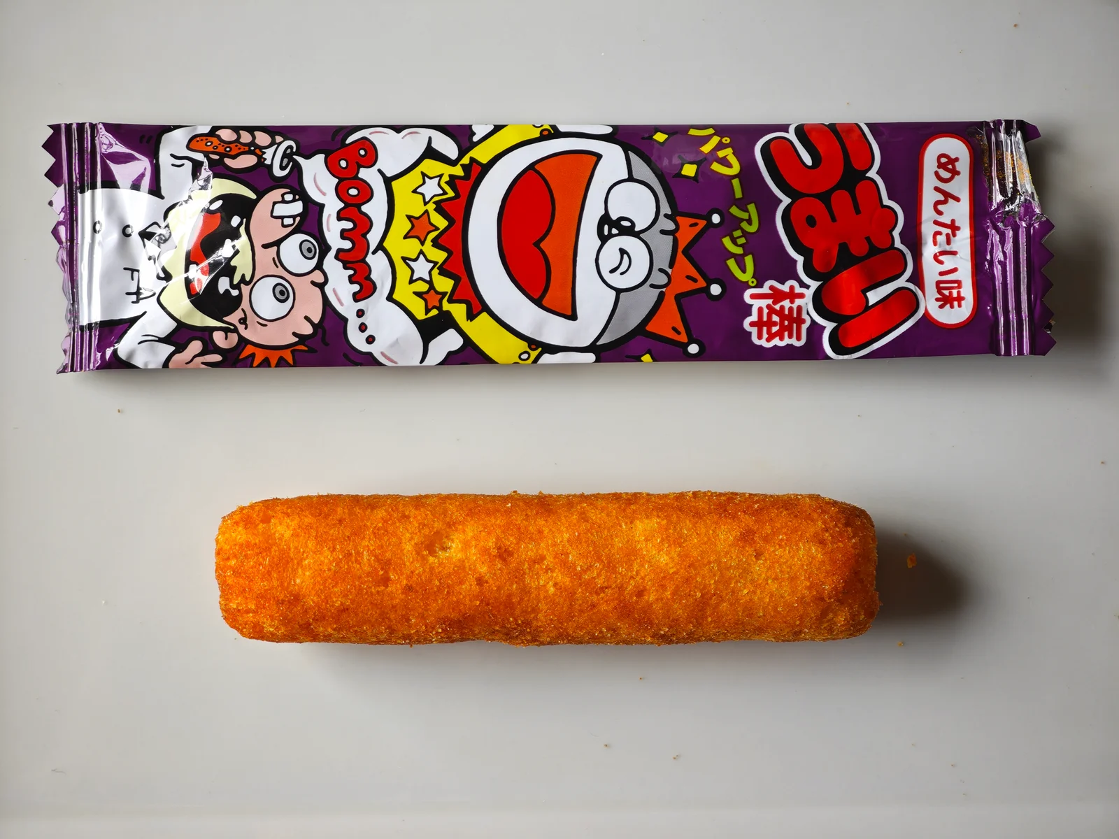 Mentai Umaibo wrapper and unwrapped corn stick