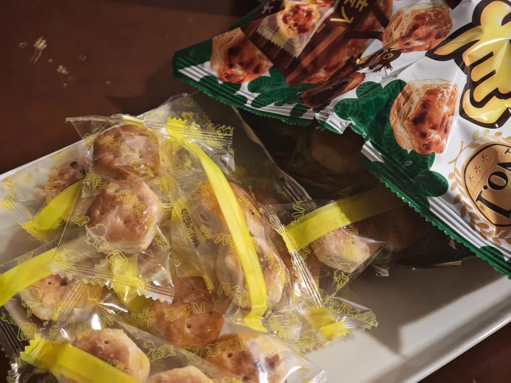 Opened Pai no Mi share pack with individual wrappers spilling out