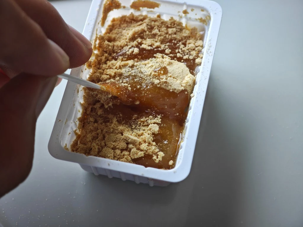 Using the included pick to open gaps so pear syrup reaches the lower kinako