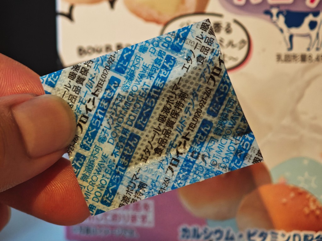 Freund food quality-retention packet held above the Cream Anpan box