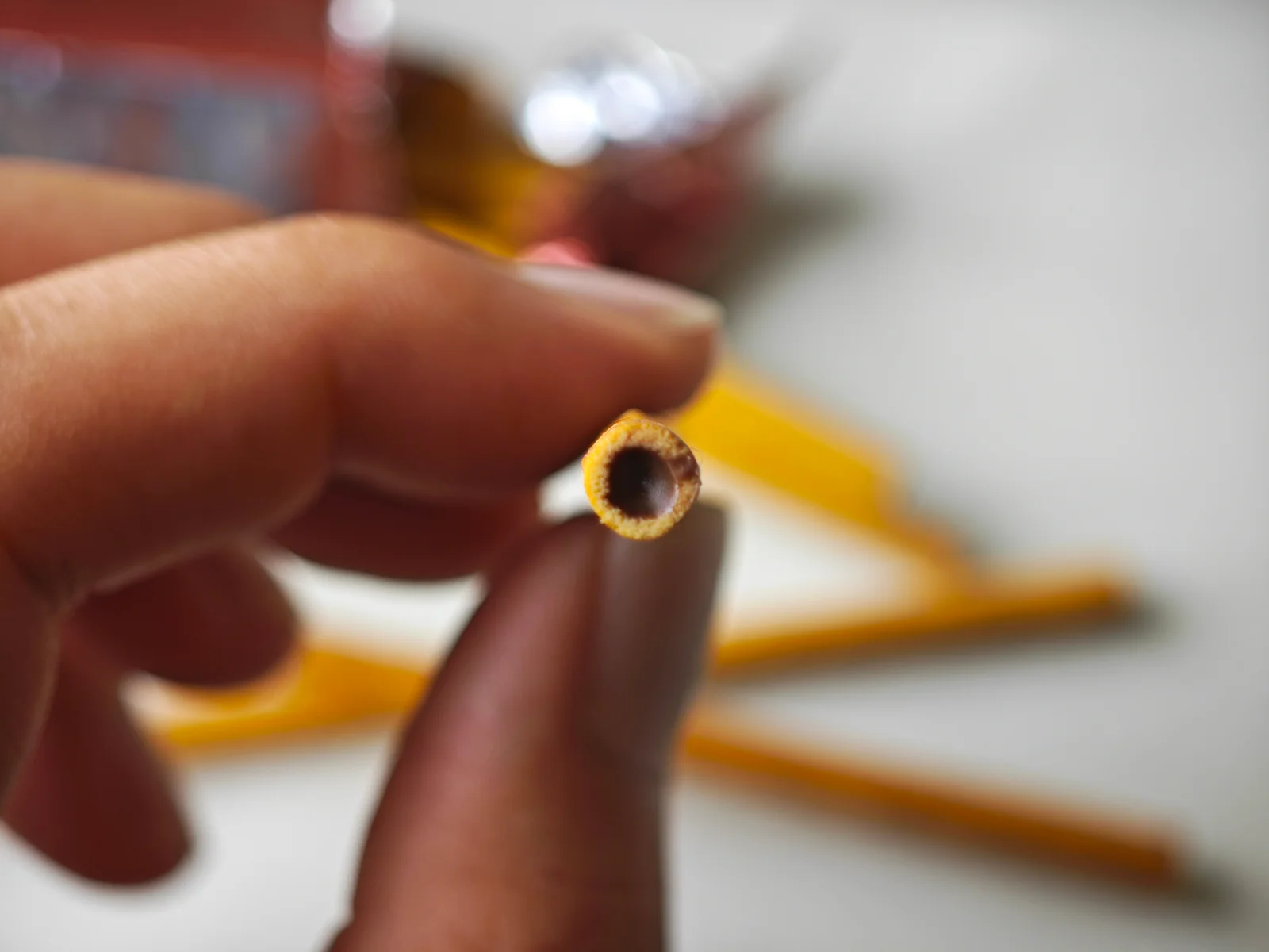 Tip end of a Toppo stick showing chocolate filled to the end