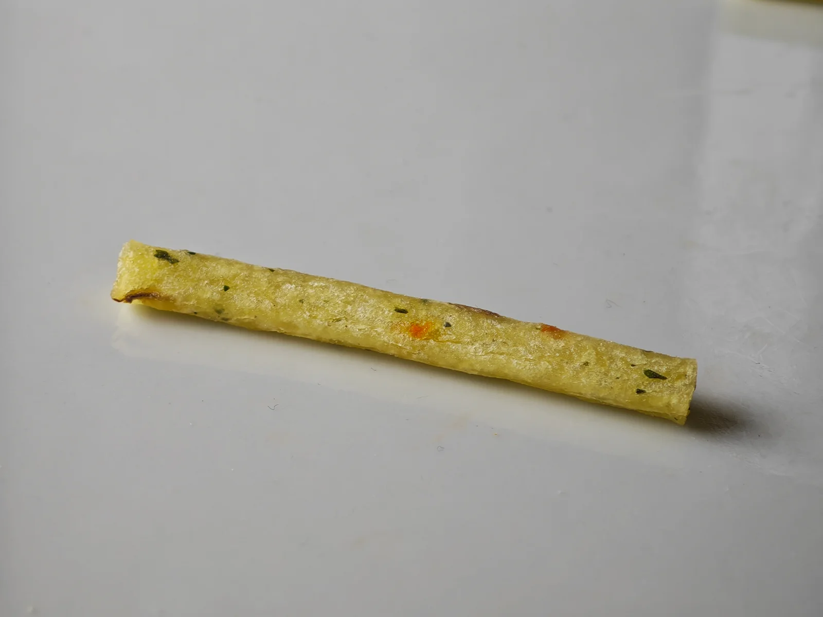 Close-up of a Salad Jagarico stick with carrot and parsley flecks