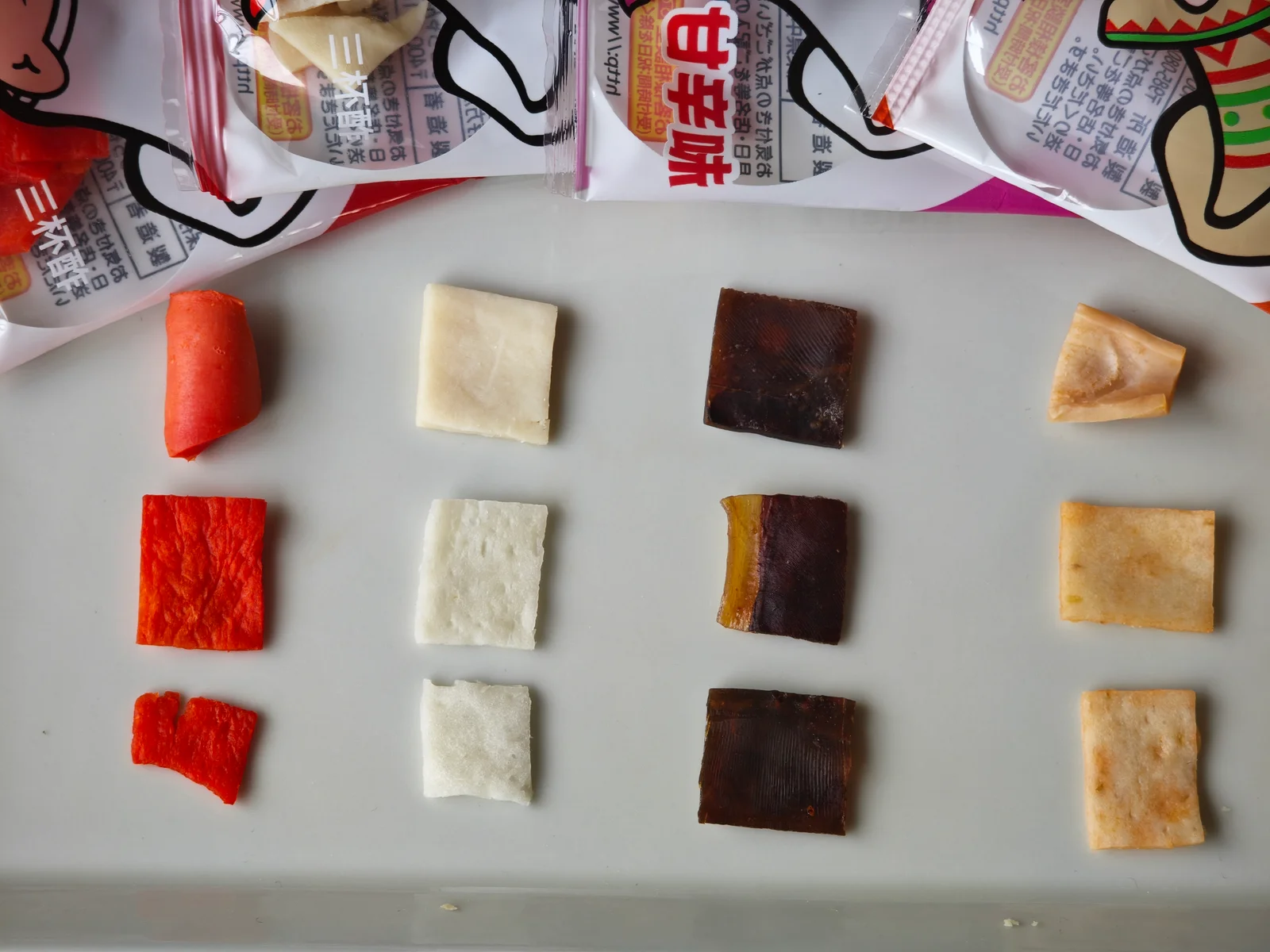 Three pieces each of four Cut Yocchan flavors compared on a plate