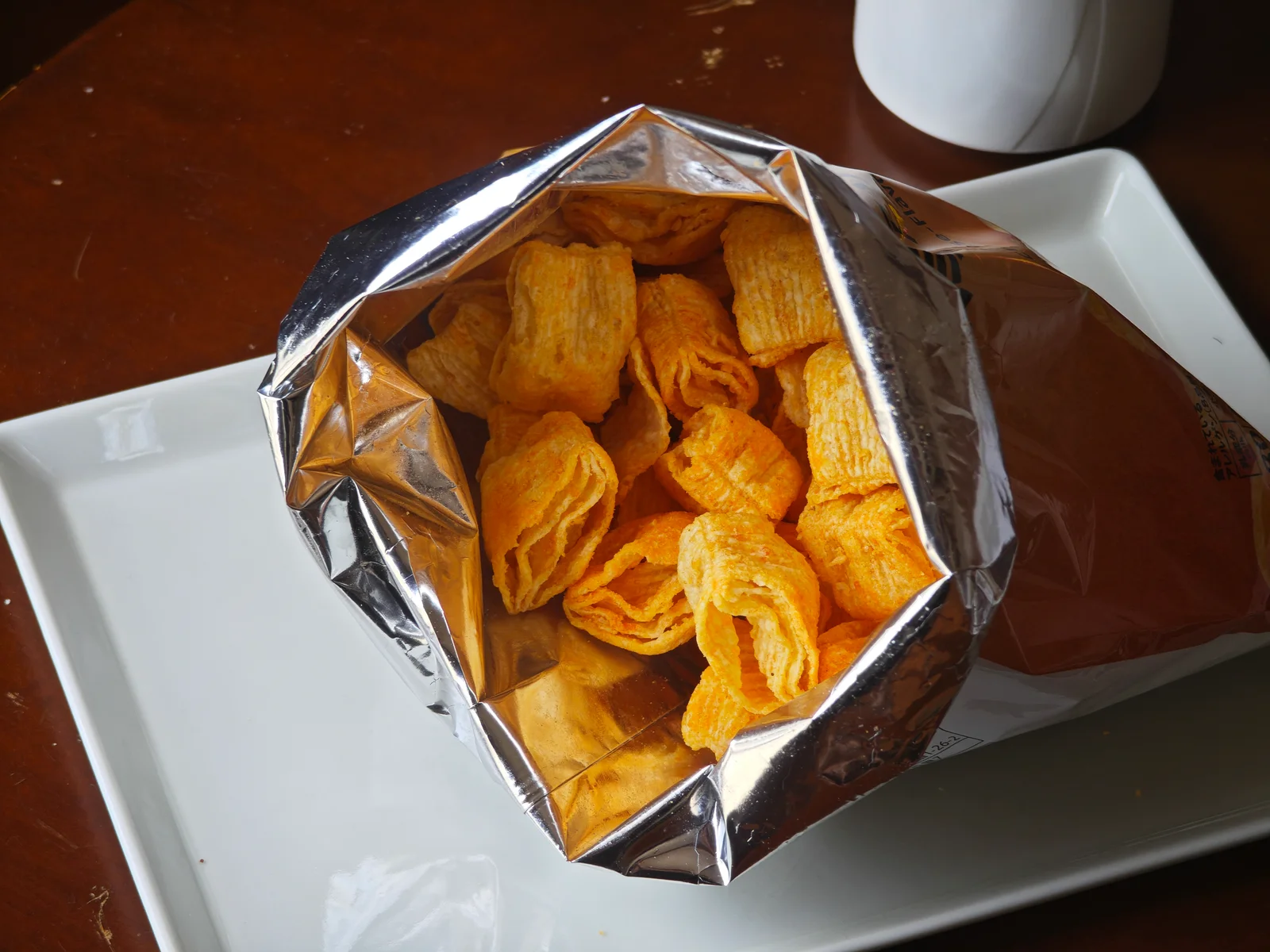 Aerial bag opened wide with the rim rolled outward into a sharing bowl