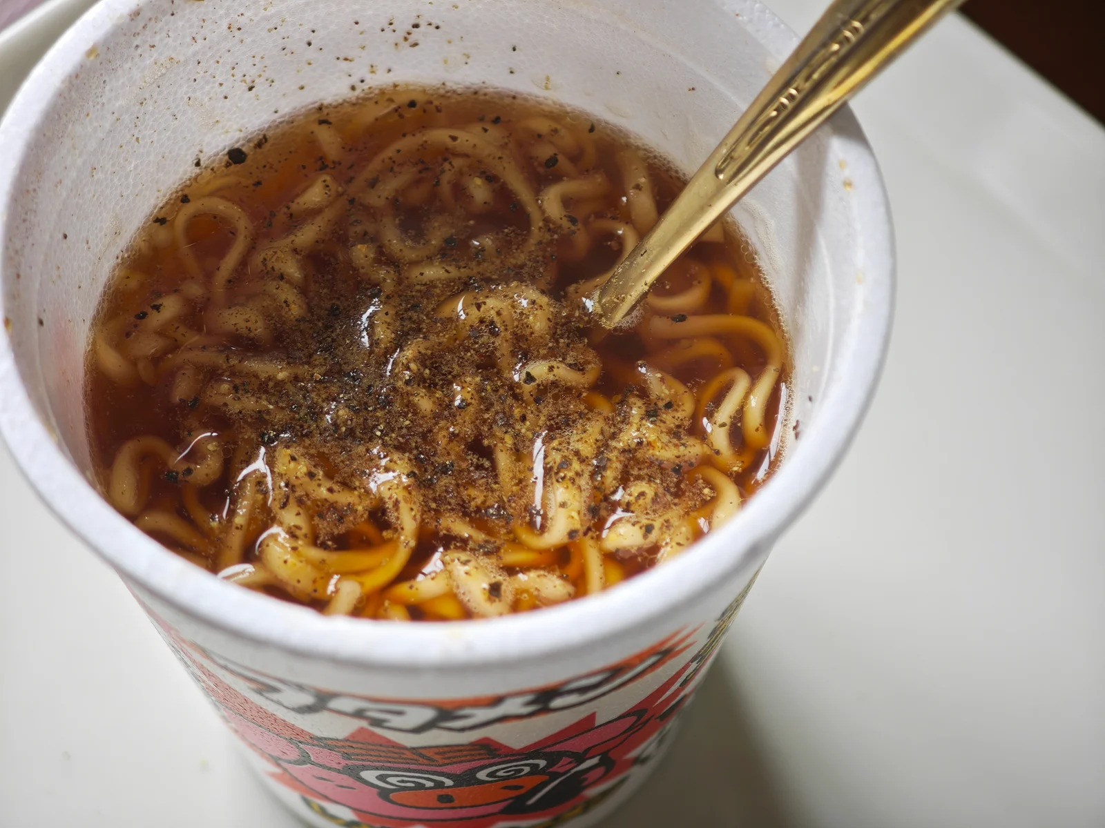 Black pepper scattered over shoyu Butamen