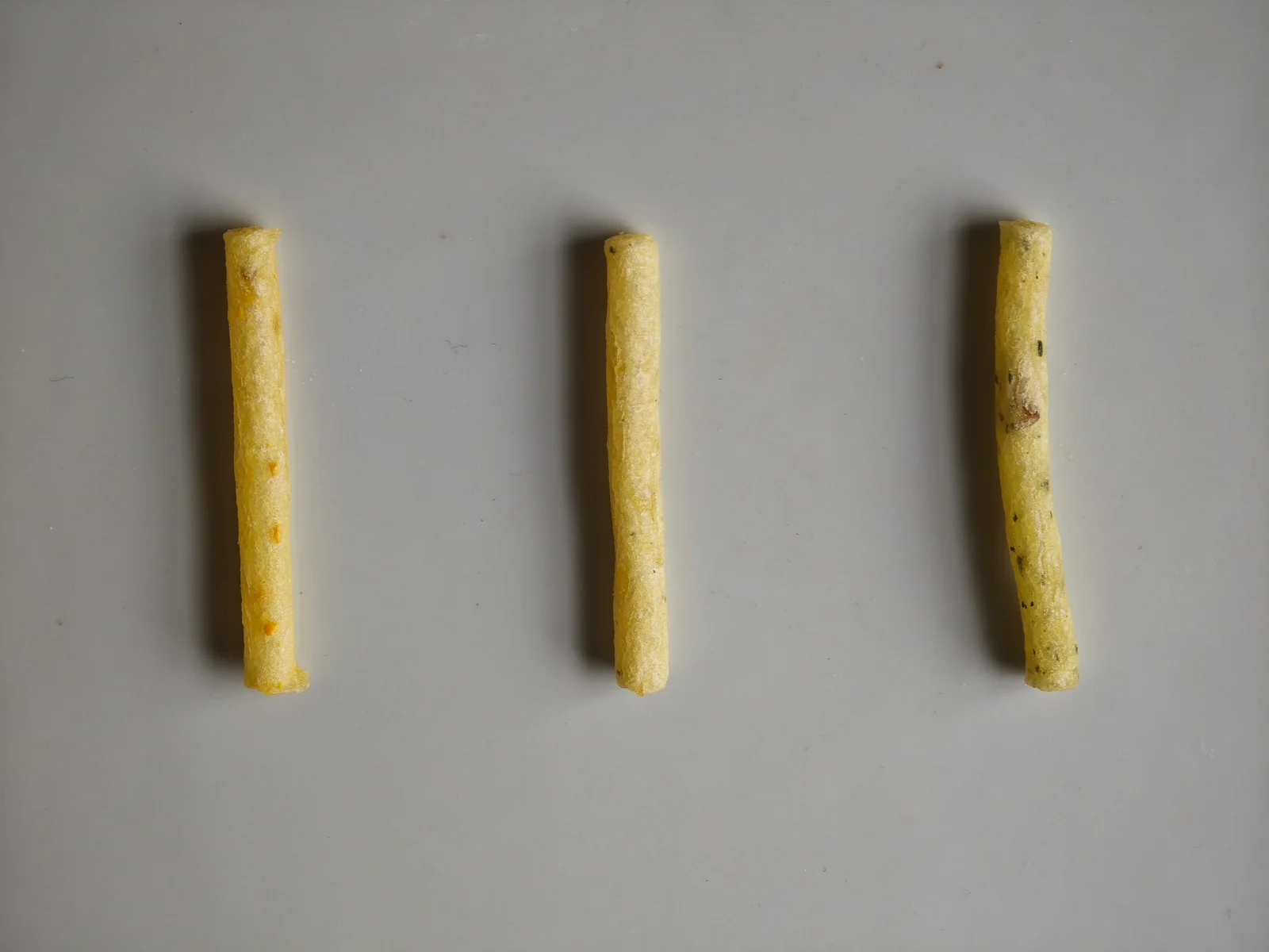 Cheese, Jaga Butter, and Salad sticks lined up from left to right