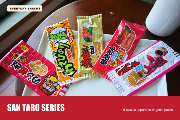 Five San Taro dagashi packs arranged on a white plate