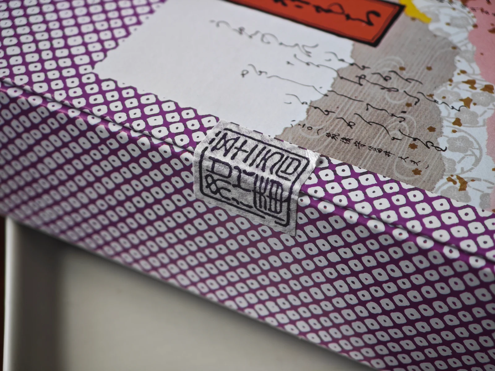 Seal-like paper closure on the purple Tsukushi Mochi gift wrapping