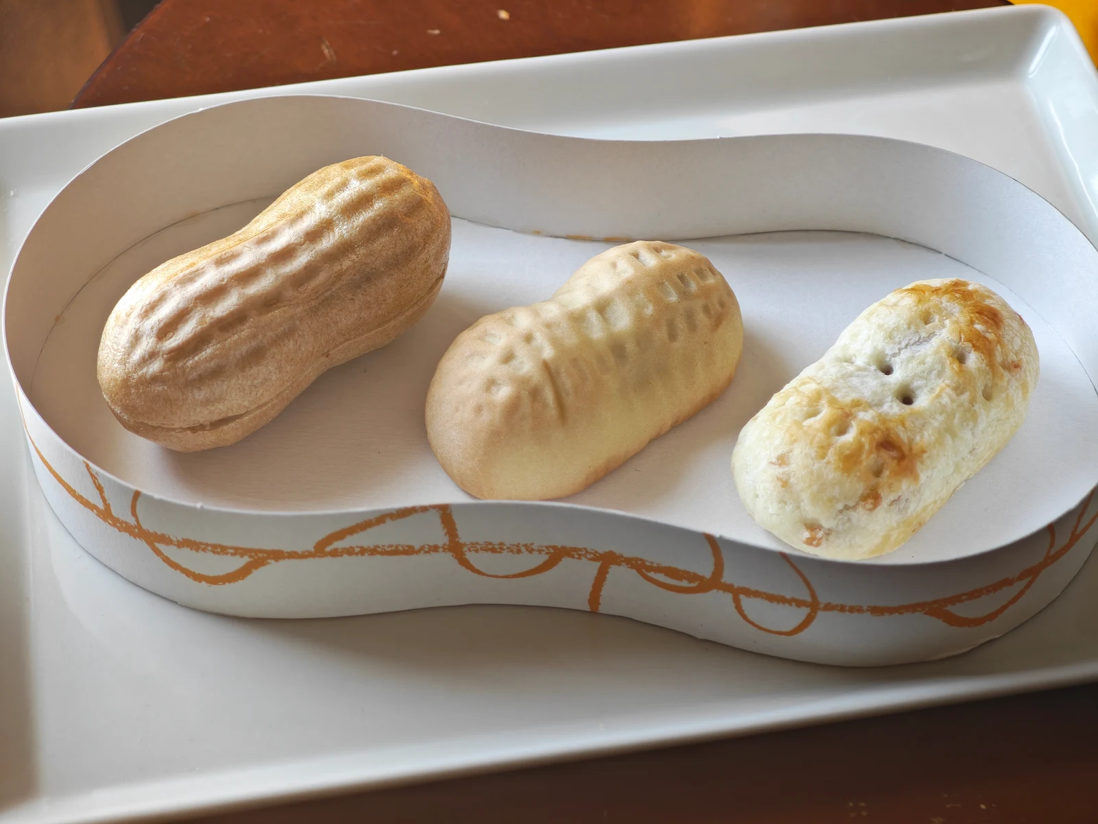Peanut Monaka, Peanut Manju, and Peanut Pie side by side in the peanut-shaped tray