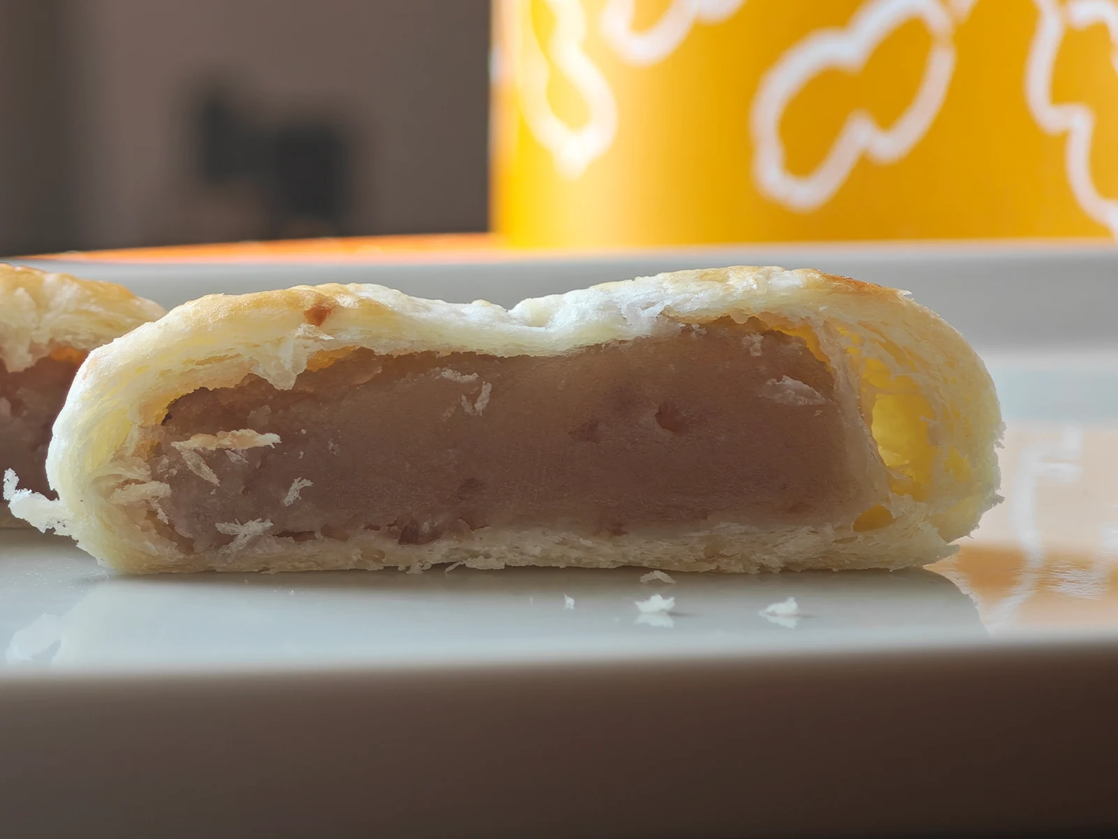 Cross-section of Peanut Pie showing flaky layered pastry surrounding peanut bean paste
